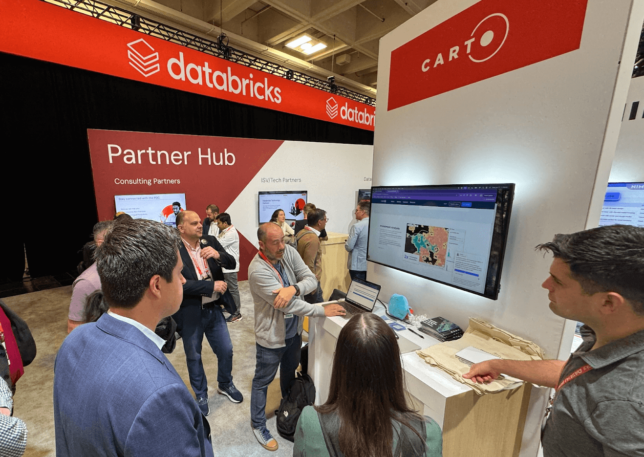 A photo of the CARTO team at the Databricks event booth